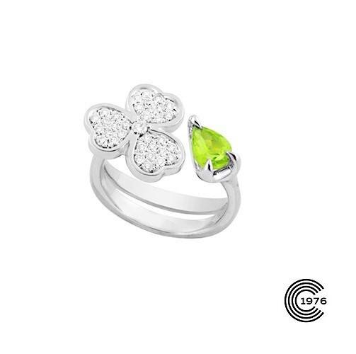 Bague en or blanc motif fleur en diamant sertie d'une pierre précieuse ou fine comme ici un Péridot